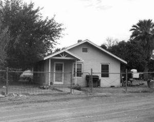 Black and white image of a zanjero house originally located along SRP canals