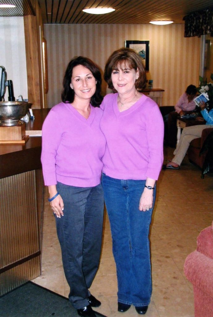 Image shows a mother and daughter in matching outfits.