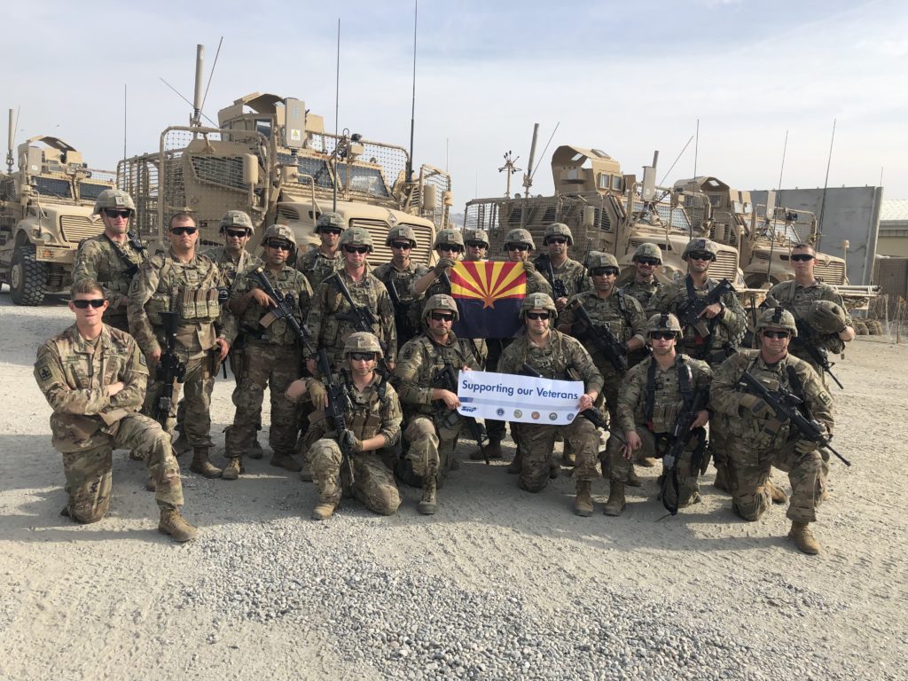 Image shows a group of troops holding an SRP banner.